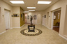Lobby.  This is the view looking east showing the entrance to Ms. French's office (at left) and the reception room (at right), with the scales of justice in the center.